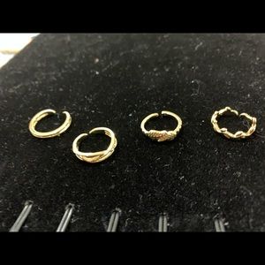 4 gold colored toe rings
